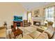 Bright living room with a fireplace and media center at 211 Collierstown Way, Peachtree City, GA 30269