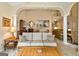 Open-concept living room with comfortable seating and seamless flow to dining and kitchen at 211 Collierstown Way, Peachtree City, GA 30269