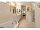 The classic bathroom has double vanity, tub, and standing shower at 211 Collierstown Way, Peachtree City, GA 30269