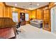 Office with wood paneling, built-in bookcase, and comfortable seating area with natural light at 211 Collierstown Way, Peachtree City, GA 30269