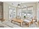 Inviting sunroom with stylish furnishings, a ceiling fan, and access to the outdoors at 211 Collierstown Way, Peachtree City, GA 30269
