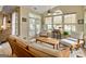 Cozy sunroom with ample natural light, comfortable seating, and a ceiling fan at 211 Collierstown Way, Peachtree City, GA 30269