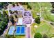 Aerial view highlighting parking lots, community pool, tennis courts, and golf course at 2304 Larchmont Ct, Villa Rica, GA 30180