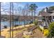 Backyard view with lake access, patio, and dock at 2304 Larchmont Ct, Villa Rica, GA 30180
