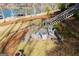 Elevated view of a lakeside backyard featuring a patio with seating and access to the water at 2304 Larchmont Ct, Villa Rica, GA 30180