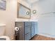 Stylish bathroom with a modern vanity, wood-look tile floor, and brushed metal fixtures at 2304 Larchmont Ct, Villa Rica, GA 30180