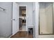View of bathroom through the door to the living room with glass enclosed shower at 2304 Larchmont Ct, Villa Rica, GA 30180