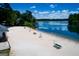 Beautiful sandy beach with lifeguard chairs overlooking tranquil water at 2304 Larchmont Ct, Villa Rica, GA 30180