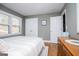 Bedroom with a queen bed, natural light, wood floors, and neutral color scheme at 2304 Larchmont Ct, Villa Rica, GA 30180