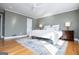 Spacious bedroom with hardwood floors, a ceiling fan, and stylish furnishings for a comfortable retreat at 2304 Larchmont Ct, Villa Rica, GA 30180