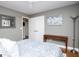 Bright bedroom with a queen bed, natural light, wood floors, and neutral color scheme at 2304 Larchmont Ct, Villa Rica, GA 30180