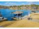 Picturesque boat dock on a serene lake with seating and covered boat storage at 2304 Larchmont Ct, Villa Rica, GA 30180