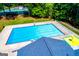 Community pool and tennis court surrounded by mature trees at 2304 Larchmont Ct, Villa Rica, GA 30180