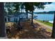 Relaxing outdoor seating at a dockside restaurant with beautiful lake views and lush greenery at 2304 Larchmont Ct, Villa Rica, GA 30180