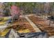 Aerial view of the long driveway leading to the property surrounded by trees at 2304 Larchmont Ct, Villa Rica, GA 30180