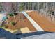 Gravel driveway leading to house surrounded by landscaped yard and mature trees at 2304 Larchmont Ct, Villa Rica, GA 30180