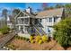 Exterior of home featuring a screened porch and spacious outdoor deck at 2304 Larchmont Ct, Villa Rica, GA 30180
