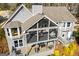 Aerial view of a home's screened porch, back deck, and backyard at 2304 Larchmont Ct, Villa Rica, GA 30180