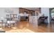 Open kitchen area with a central island, stainless steel appliances, and adjacent dining area, creating a welcoming space at 2304 Larchmont Ct, Villa Rica, GA 30180