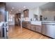 Spacious kitchen with stainless steel appliances, wood cabinets, hardwood floors, and plenty of natural light at 2304 Larchmont Ct, Villa Rica, GA 30180
