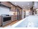 Modern kitchen with stainless steel appliances, stylish wooden cabinets, white subway tile backsplash, and hardwood floors at 2304 Larchmont Ct, Villa Rica, GA 30180