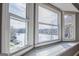 Bright, scenic view of the lake from a bedroom bay window, showcasing the surrounding trees and calm waters at 2304 Larchmont Ct, Villa Rica, GA 30180