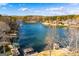 Expansive lake view highlighting the calm waters and the charming homes along the shoreline at 2304 Larchmont Ct, Villa Rica, GA 30180