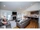Bright, open-concept living room with a stone fireplace, vaulted ceiling, and access to the outdoors at 2304 Larchmont Ct, Villa Rica, GA 30180