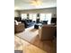 Spacious living area with plush sofas, natural light, and ample seating options at 2304 Larchmont Ct, Villa Rica, GA 30180