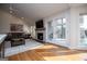 Spacious living room with a fireplace, modern decor, and access to outdoor space at 2304 Larchmont Ct, Villa Rica, GA 30180