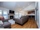 Open living space with fireplace, hardwood floors, and seamless flow between living, dining, and kitchen areas at 2304 Larchmont Ct, Villa Rica, GA 30180