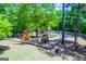 Community playground featuring colorful play structures and ample space for recreational activities at 2304 Larchmont Ct, Villa Rica, GA 30180