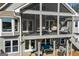 Relaxing screened porch with comfortable seating and ceiling fan, perfect for enjoying the outdoors at 2304 Larchmont Ct, Villa Rica, GA 30180