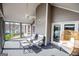 Cozy screened porch with lake views, comfortable seating, and tranquil ambiance at 2304 Larchmont Ct, Villa Rica, GA 30180