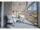 Relaxing screened porch with comfortable seating and scenic views at 2304 Larchmont Ct, Villa Rica, GA 30180