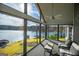 Beautiful sunroom with lake views, providing a perfect space to relax and enjoy the scenery at 2304 Larchmont Ct, Villa Rica, GA 30180