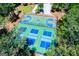 Community tennis and pickleball courts surrounded by mature trees at 2304 Larchmont Ct, Villa Rica, GA 30180