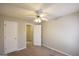 This is a standard bedroom with neutral walls and a ceiling fan at 626 N Fairfield Dr, Peachtree City, GA 30269