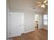 A bright bedroom features a vaulted ceiling, ceiling fan, and access to an ensuite bathroom at 626 N Fairfield Dr, Peachtree City, GA 30269