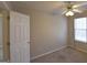 Bedroom features carpet flooring, neutral paint, a ceiling fan, and a window for natural light at 626 N Fairfield Dr, Peachtree City, GA 30269