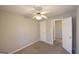 Neutral bedroom featuring plush carpet and ceiling fan at 626 N Fairfield Dr, Peachtree City, GA 30269
