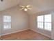 Inviting bedroom with wood floors, natural light, and closet space at 626 N Fairfield Dr, Peachtree City, GA 30269
