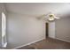 Standard bedroom with carpet, neutral walls, and a ceiling fan at 626 N Fairfield Dr, Peachtree City, GA 30269