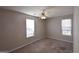 Bright bedroom with neutral walls, carpet, and natural light at 626 N Fairfield Dr, Peachtree City, GA 30269