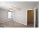 This bedroom has neutral walls and carpet at 626 N Fairfield Dr, Peachtree City, GA 30269