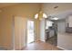 Light-filled dining area features wood floors and a stylish chandelier and access to the exterior at 626 N Fairfield Dr, Peachtree City, GA 30269