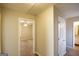 Hallway with doors opening to a bedroom and bathroom, providing a glimpse of the interior layout at 626 N Fairfield Dr, Peachtree City, GA 30269