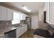 Modern kitchen boasts stainless steel appliances, granite countertops, and ample cabinet space at 626 N Fairfield Dr, Peachtree City, GA 30269