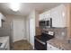 Well-equipped kitchen with stainless appliances, granite counters, and plenty of storage at 626 N Fairfield Dr, Peachtree City, GA 30269
