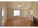 Spacious living room features wood floors, ceiling fan, and ample natural light at 626 N Fairfield Dr, Peachtree City, GA 30269